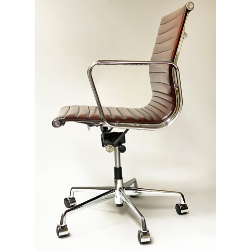 117 - REVOLVING DESK CHAIR, Charles and Ray Eames inspired with ribbed tan leather seat revolving and recl... 