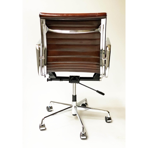 117 - REVOLVING DESK CHAIR, Charles and Ray Eames inspired with ribbed tan leather seat revolving and recl... 