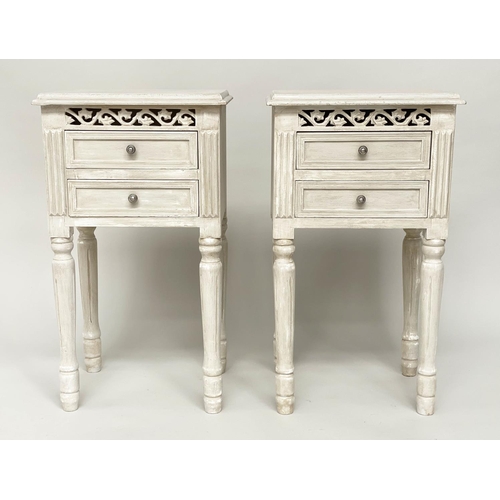 112 - BEDSIDE CHESTS/TABLES, a pair, French style traditionally grey painted each with pierced frieze and ... 