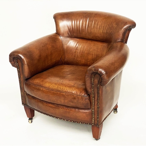 115 - PROFESSOR STYLE TUB ARMCHAIR, buttoned aged brass studded tan leather with rounded back and arms, 80... 