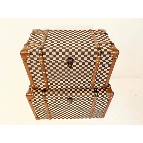 457 - TRUNKS, a graduated pair, largest measuring 42cm high, 72cm wide, 42cm deep, damier style upholstere... 