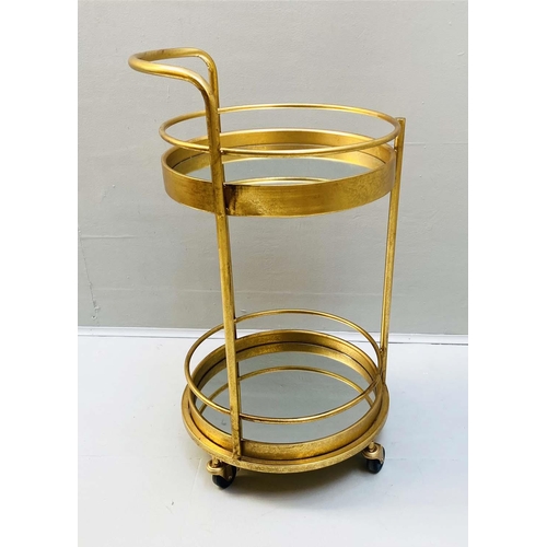 449 - COCKTAIL TROLLEY, 77cm high, 42cm diameter, 1960s French style, mirrored glass tiers, gilt metal fra... 