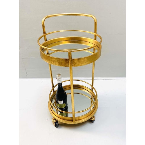 449 - COCKTAIL TROLLEY, 77cm high, 42cm diameter, 1960s French style, mirrored glass tiers, gilt metal fra... 