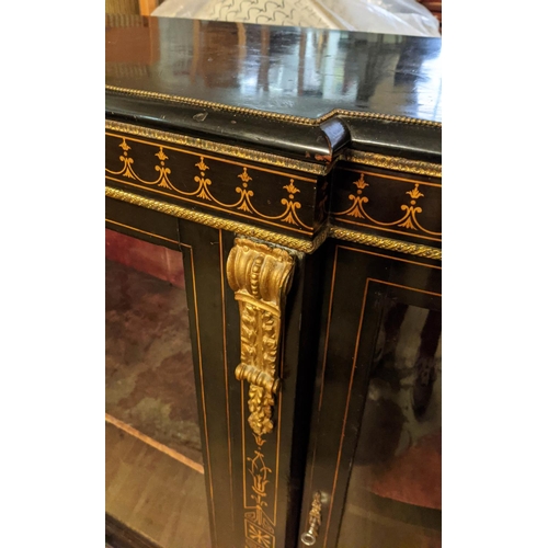 147 - CREDENZA, Victorian circa 1880, ebonised with bowed glazed doors to ends, central glazed door, velve... 