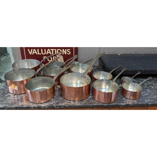 146 - BATTERIE DE CUISINE, comprising twelve copper pans. (12)