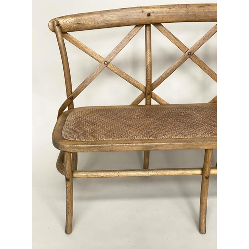 183 - OKA HALL BENCH, bentwood framed with 'X' back and woven cane seat, 135cm W.