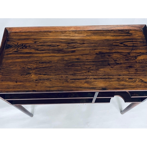 346 - LOW TABLE, 1970's rosewood, with galleried top and open shallow filing shelves, 72cm x 33cm x 62cm H... 