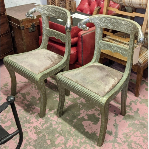 161 - SIDE CHAIRS, a pair, each 62cm W x 88cm H, Indian metal with rams head detail. (2)