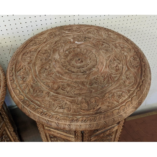 168 - ASIAN SIDE TABLES, a pair, each 47cm H x 46cm W, the circular carved wood tops on folding bases. (2)