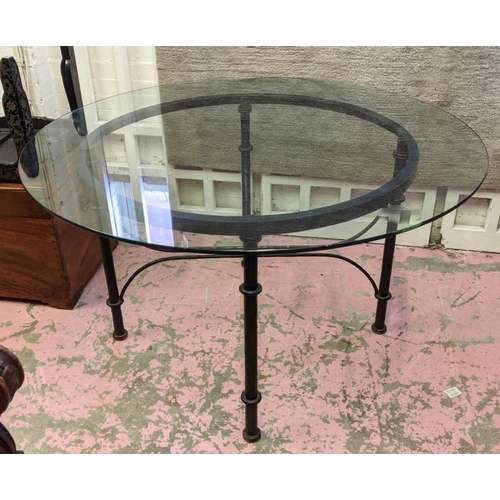 169 - DINING TABLE, 101cm W x 74cm H, the circular glass top on a metal base.