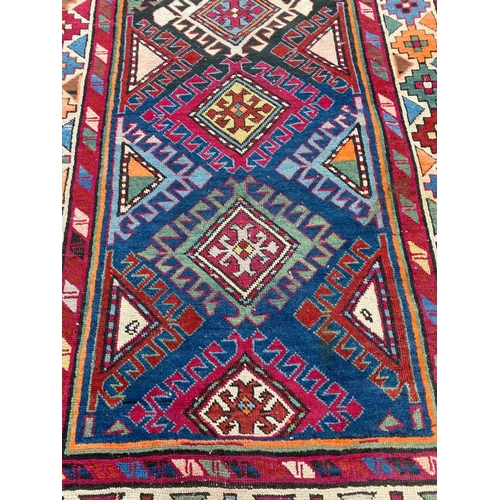 56 - ANTIQUE CAUCASIAN RUNNER, 280cm x 115cm.