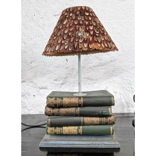 328 - TABLE LAMPS, a pair, 42cm H, made from vintage novels, with pheasant feather shades. (2)