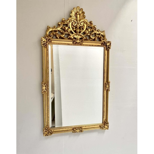 417 - WALL MIRROR, 125cm high, 67cm wide, Baroque style, gilt frame, bevelled edge glass, shell moulded fi... 