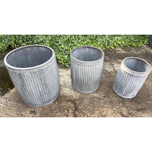 386 - GARDEN PLANTERS, a graduated set of three, largest 50cm high x 45cm diam., galvanised finish. (3)