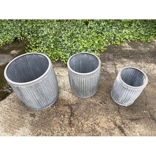 386 - GARDEN PLANTERS, a graduated set of three, largest 50cm high x 45cm diam., galvanised finish. (3)