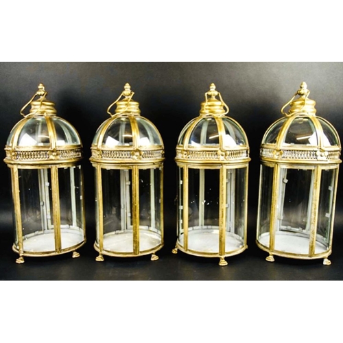 388 - STORM LANTERNS, set of four, 49cm high, 20cm diameter, Regency style, glazed sides and glazed dome t... 