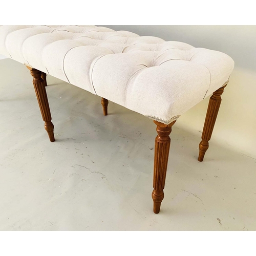 393 - HALL SEAT, 51cm high, 122cm long, 44cm deep, deep buttoned neutral upholstery, raised on turned legs... 