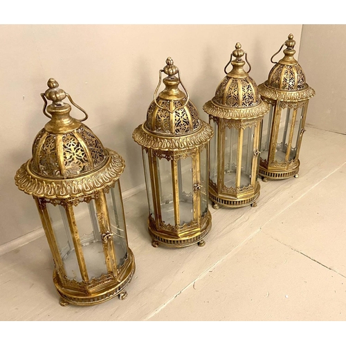 399 - STORM LANTERNS, a set of four, 61cm H x 21cm diam., Regency style, pierced gilt metal frames, glazed... 