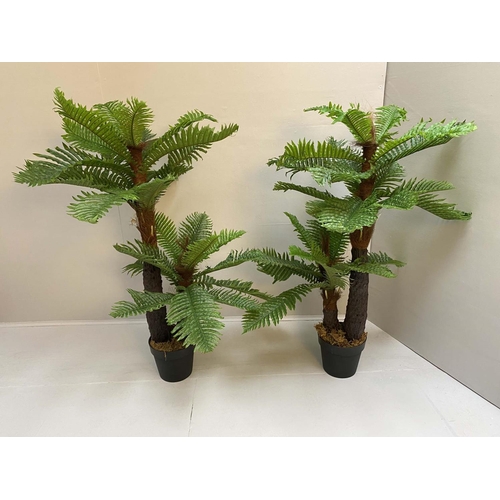 311 - FAUX FERN TREES, a pair, 120cm H x 60cm diam., fitted in black planters. (2)