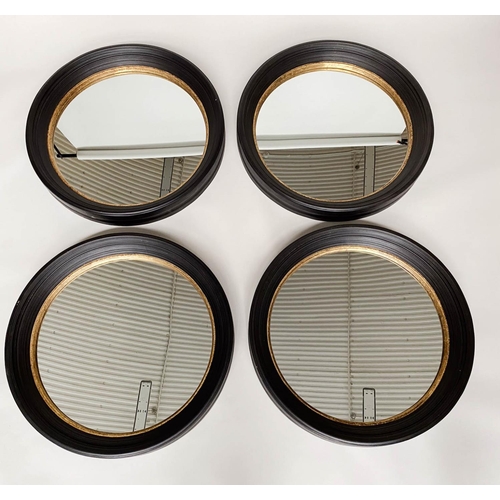 269 - WALL MIRRORS, a set of four, Regency style circular ebonised and gilt each 95cm W. (4)