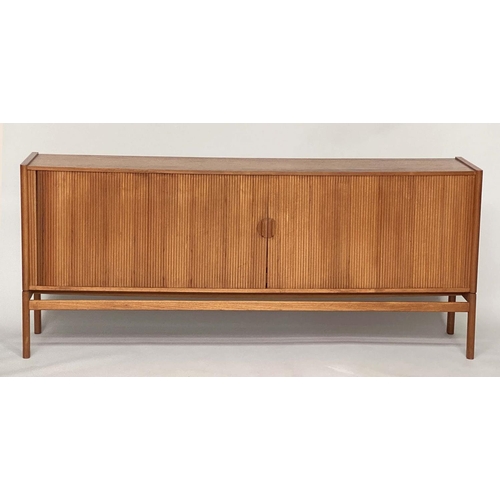 274 - SIDEBOARD, mid 20th century teak, with tambour sliding front enclosing four shelves and four sliding... 