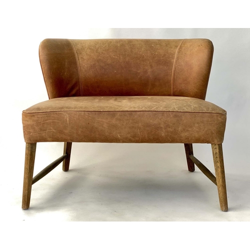 277 - OKA LOUNGE CHAIR, stitched and piped leather on stretchered splay supports, 140cm W.