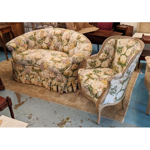 162 - KIDNEY SHAPED SOFA, 155cm W x 80cm H, in a floral fabric and a bergere with carved showframe and mat... 