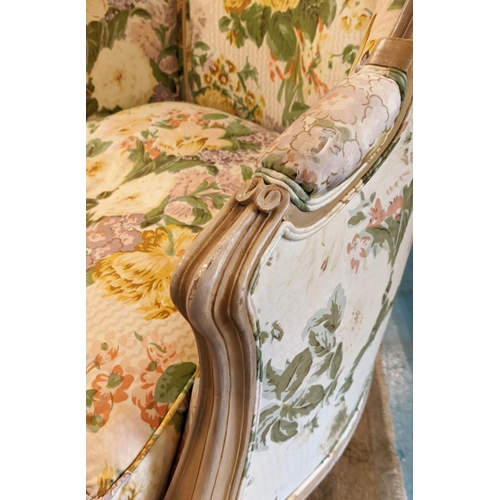 162 - KIDNEY SHAPED SOFA, 155cm W x 80cm H, in a floral fabric and a bergere with carved showframe and mat... 