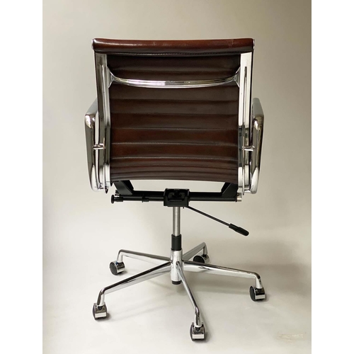 100 - REVOLVING DESK CHAIR, Charles and Ray Eames inspired with ribbed mid brown leather seat, revolving a... 