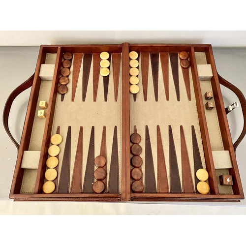 405 - BACKGAMMON SET, in a leathered case 7cm x 40cm x 23cm.