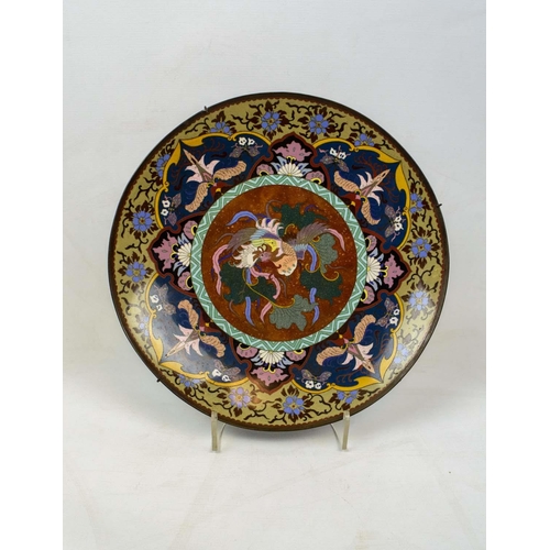 12 - JAPANESE CLOISONNE CHARGER, with a central phoenix surrounded by foliate decorations, 36cm D.