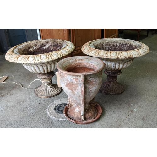 164 - CAST IRON GARDEN URNS, Victorian, a pair, each 60cm x 47cm, white painted and a terracotta urn, 46cm... 