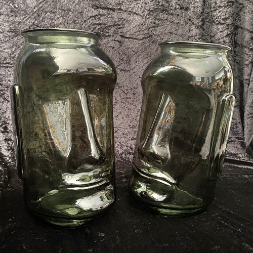 297 - RAPS NUI STYLE VASES, a pair, green tinted glass, 35cm high.