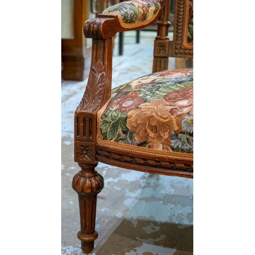 203 - CANAPE, 95cm H x 133cm W, early 20th century French stained oak in floral upholstery.