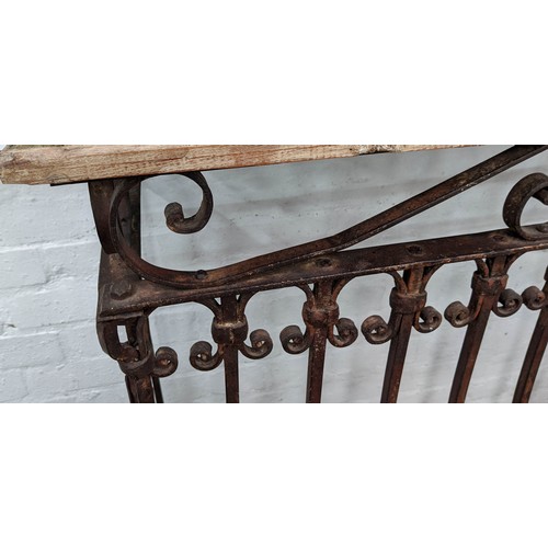 427 - CONSOLE TABLES, two, 135cm x 40cm x 104cm, French provincial style design, wrought metal base. (2)