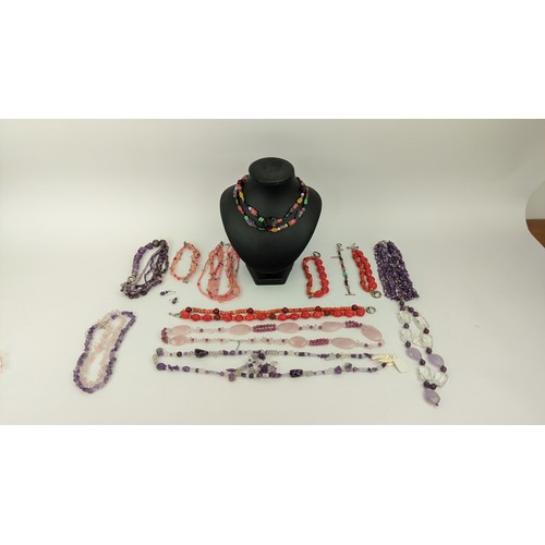 15 - A COLLECTION OF GEMSTONE JEWELLERY, comprising amethyst six-strand chip necklace, an amethyst and ro... 