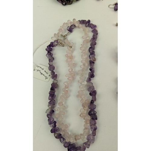 15 - A COLLECTION OF GEMSTONE JEWELLERY, comprising amethyst six-strand chip necklace, an amethyst and ro... 