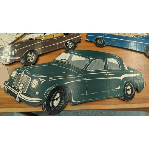 440 - VINTAGE CAR WALL PANELS, 20th century polychrome finish, 89cm x 44cm at largest. (3)