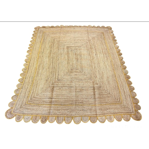 110 - SCALLOPED EDGE JUTE RUG, 308cm x 244cm.