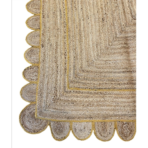 110 - SCALLOPED EDGE JUTE RUG, 308cm x 244cm.