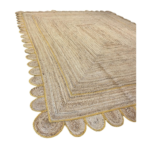 110 - SCALLOPED EDGE JUTE RUG, 308cm x 244cm.