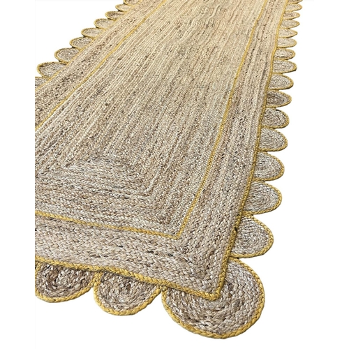 111 - SCALLOPED EDGE JUTE RUNNER, 300cm x 91cm.