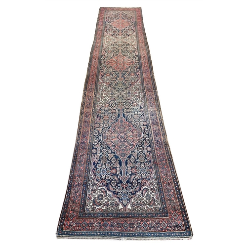 130 - ANTIQUE FEREGHAN RUNNER, 498cm x 101cm.