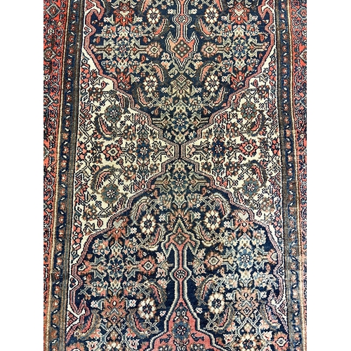 130 - ANTIQUE FEREGHAN RUNNER, 498cm x 101cm.