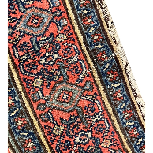 130 - ANTIQUE FEREGHAN RUNNER, 498cm x 101cm.