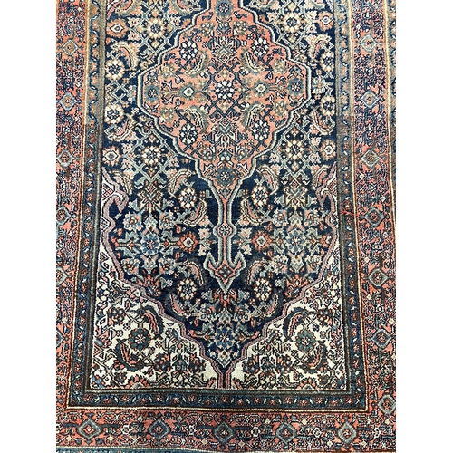 130 - ANTIQUE FEREGHAN RUNNER, 498cm x 101cm.