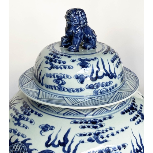 148 - DRAGON TEMPLE VASES, a pair, Chinese blue and white ceramic floor standing with lids, 105cm H. (2)