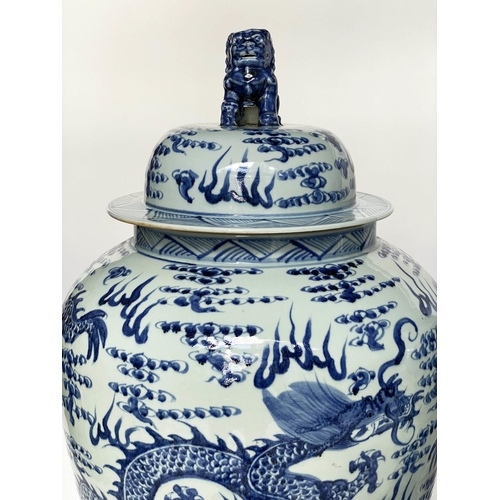 148 - DRAGON TEMPLE VASES, a pair, Chinese blue and white ceramic floor standing with lids, 105cm H. (2)