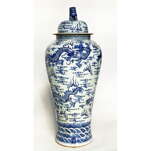 148 - DRAGON TEMPLE VASES, a pair, Chinese blue and white ceramic floor standing with lids, 105cm H. (2)