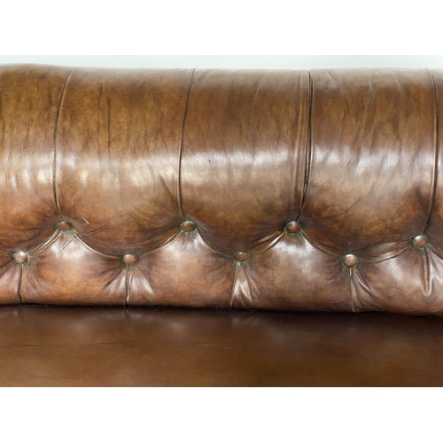 181 - CHESTERFIELD SOFA, Victorian mahogany with faded tan brown brass studded leather with button back an... 